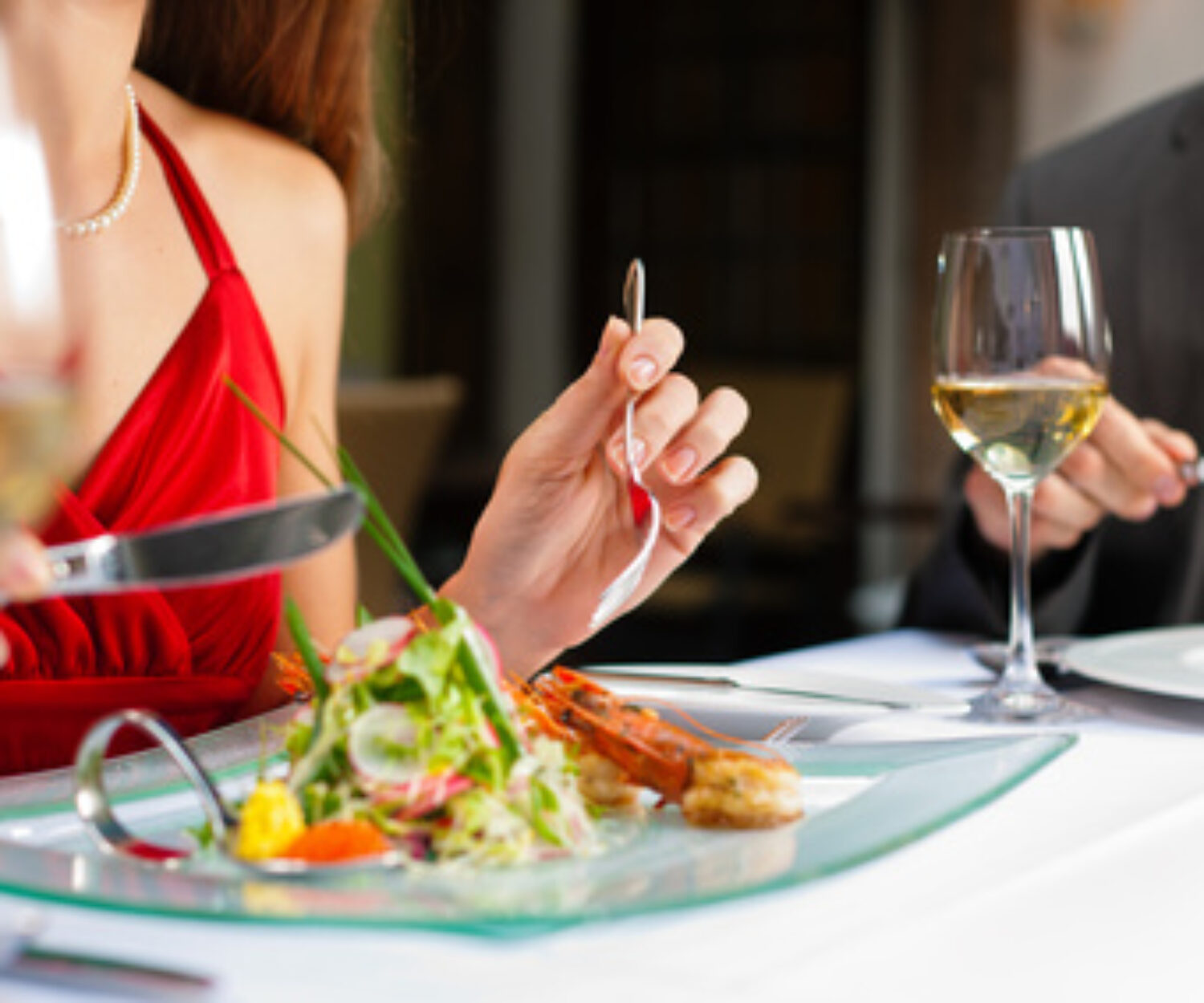 Couple eating and drinking in very good restaurant