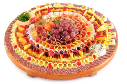 Cheese, meat, and fruit display.